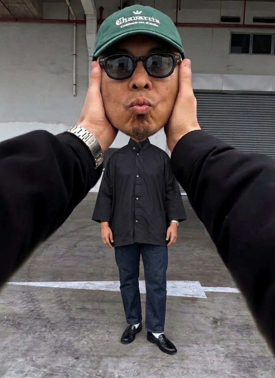A playful forced-perspective portrait of Ianto Creatives founder Yanto Sani